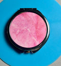 Miroir de sac compact au joli design