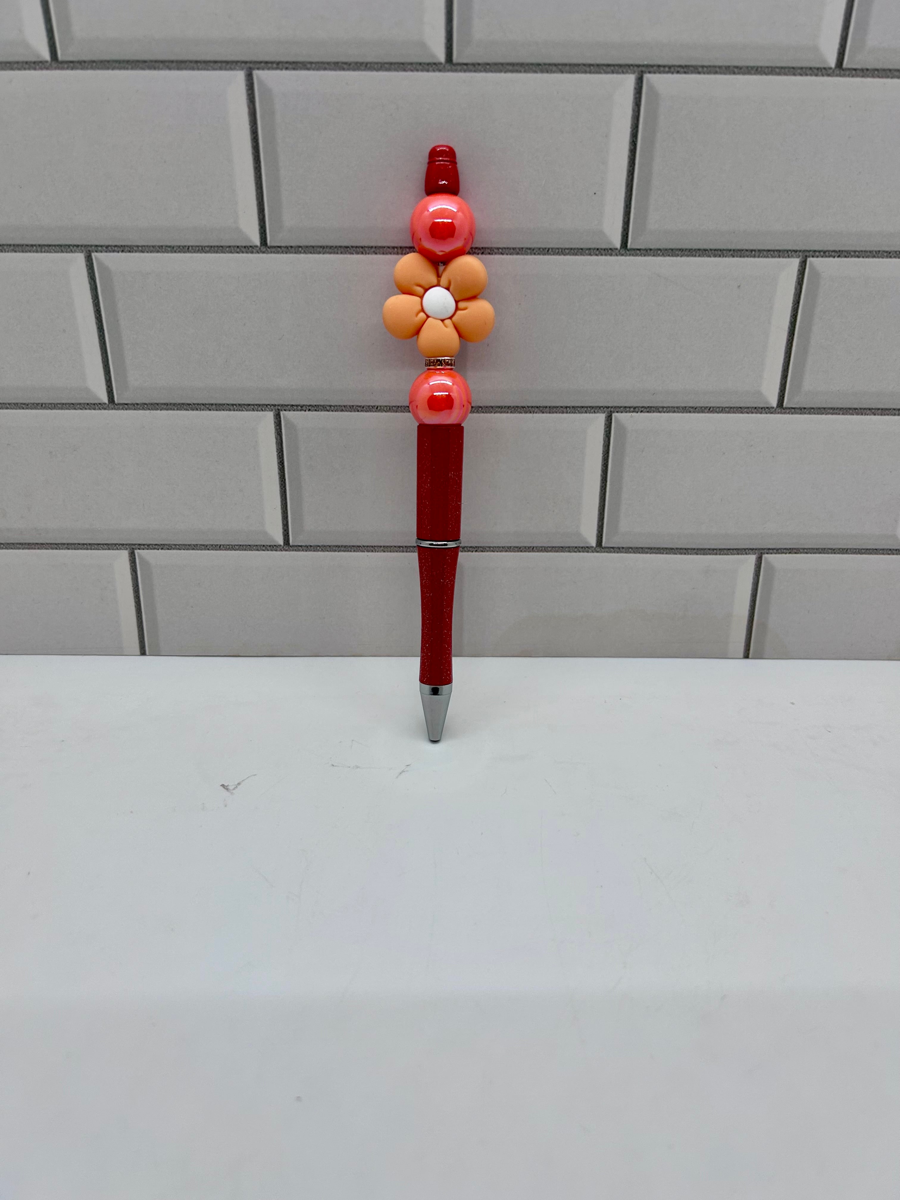 Stylo bille perlé - Acrylique orange avec fleur décorative