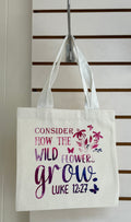 Mini sac cabas en toile avec anses blanches, orné d'un magnifique motif inspirant. 25x25 cm