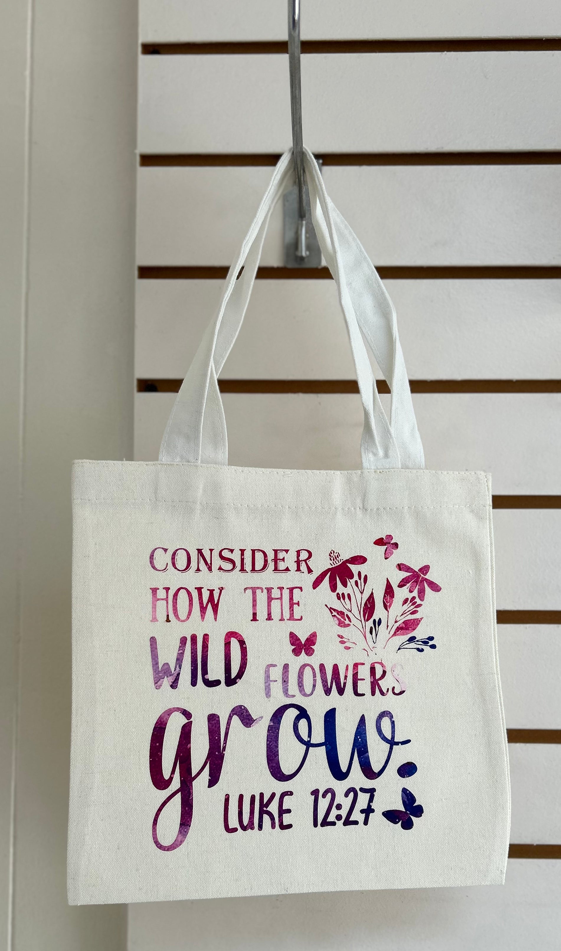 Mini sac cabas en toile avec anses blanches, orné d'un magnifique motif inspirant. 25x25 cm