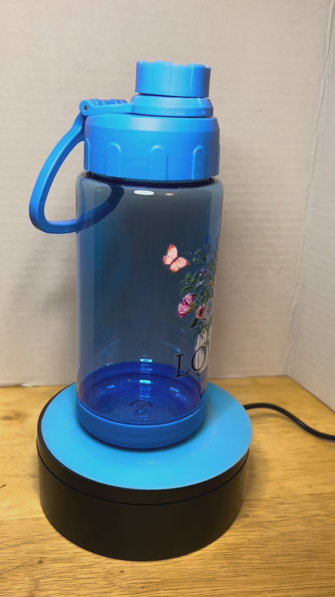 14 oz Plastic Water Bottle with Handle and Screw on Lid featuring a Beautiful Design